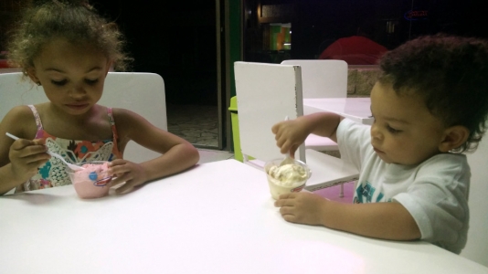 Old enough to each get their own cup of ice cream now.